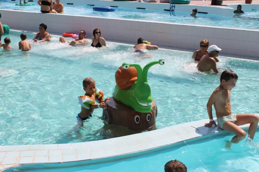Snail Waterspout on Smiling Tree Trunk